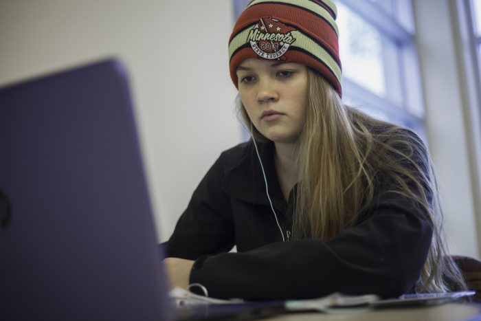 Female student using her computer