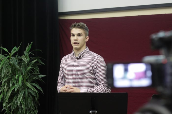 Male student giving a speech