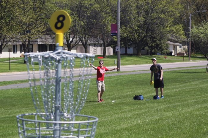 Students playing disc golf