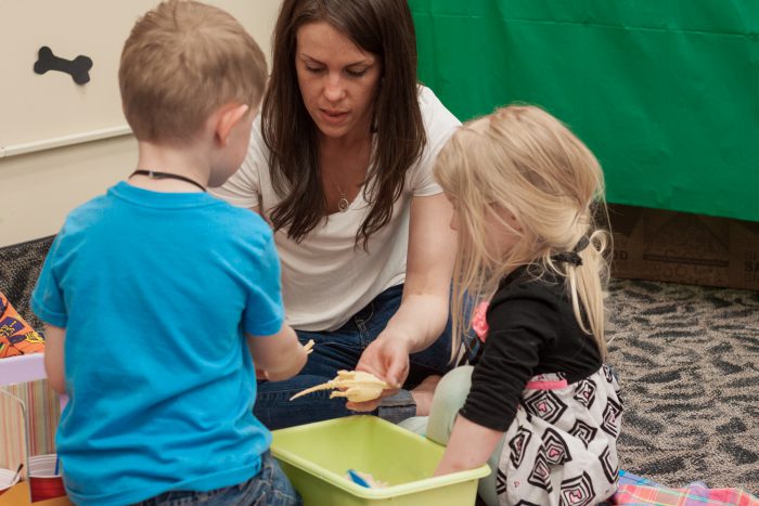 Early childhood student working with a preschooler