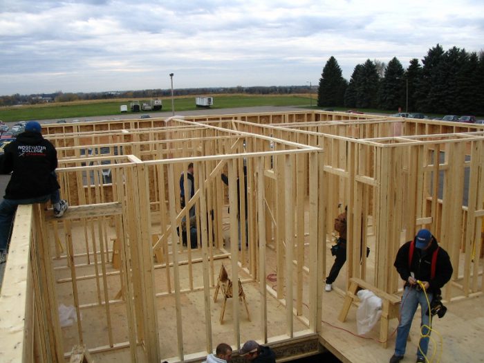 carpentry students building a house