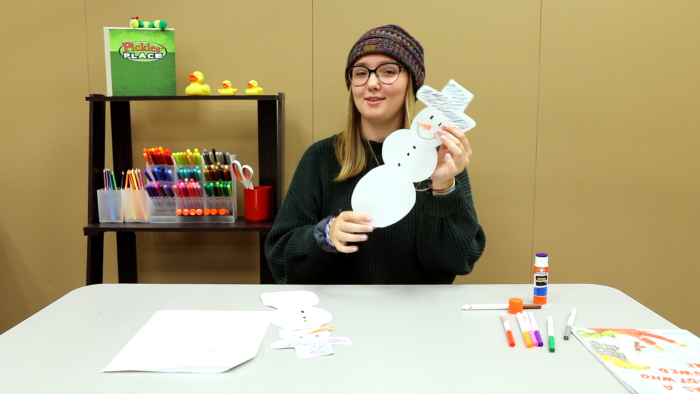 Photo of Jerika Ziermann showing off a craft project