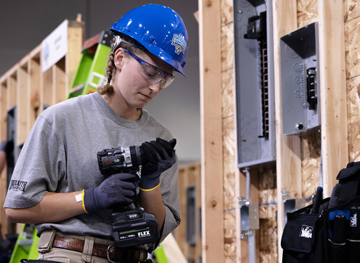 female electrician student working 