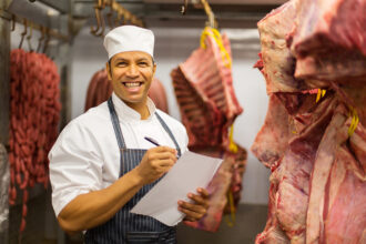 Photo of butcher in meat locker