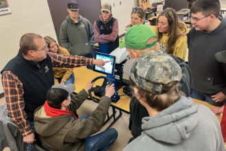 Photo of Agriculture students exploring new Precision Ag simulator
