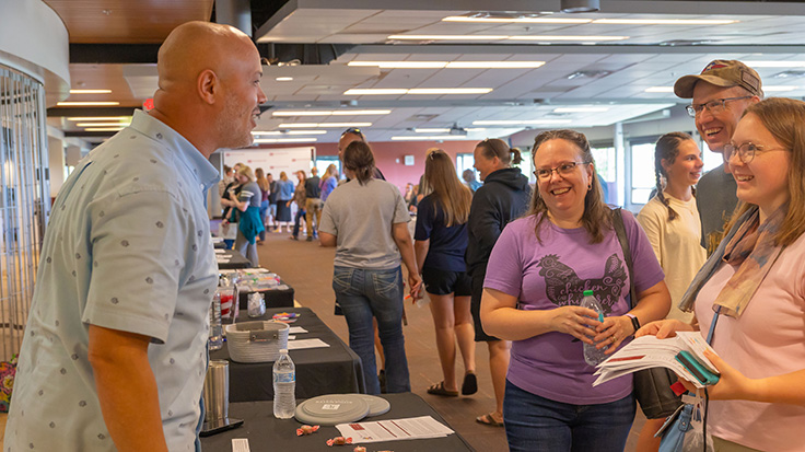 photo of staff helping student