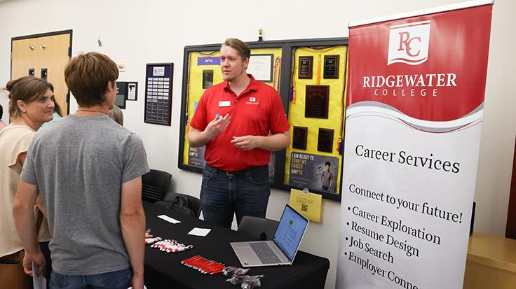 Photo of career services table at partner event